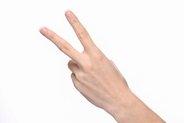 Female hand shows two fingers isolated on white background.