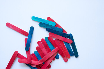 randomly arranged wood sticks on a light background