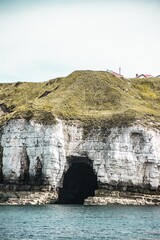 white cliffs in bright blue sea