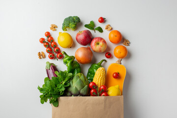 Delivery healthy food background. Healthy vegan vegetarian food in paper bag vegetables and fruits...