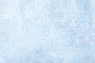 Old rough blue concrete wall, stucco pattern, photo texture. White peeling plaster. Light beton background. Cement grunge shabby surface.