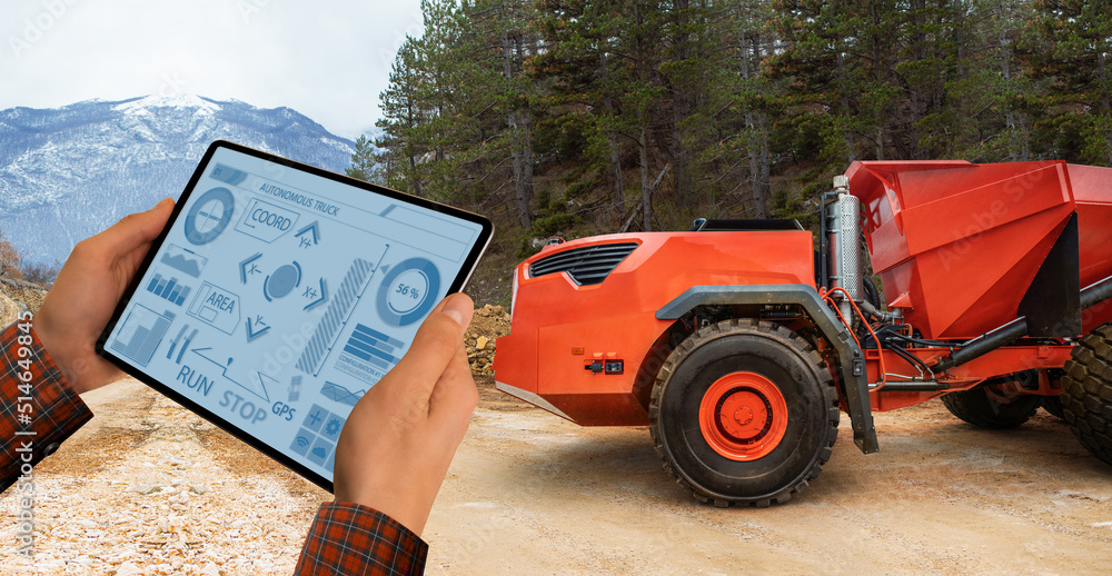 Aufkleber engineer programs autonomous mining truck using digital tablet
