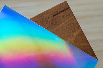 iridescent paper on a wooden object