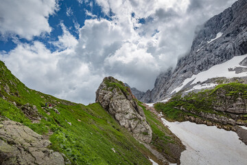 Mountain hiking Trail Road. Small mountain lake. Between Italy and Austria: near Volaia Lake Raunchkofer Mountain (Lago di Volaia Monte Rauchkofel)