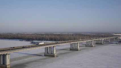 Fototapeta na wymiar Bridge with cars at the entrance to Barnaul Russia