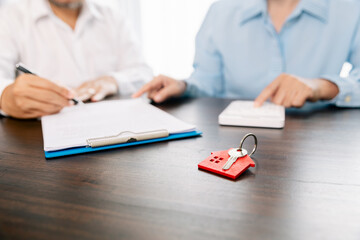 Real estate brokers or real estate agent with client or architect team Discussions about contracts , Saving money to invest in house or property in the future. Business property Concept.