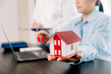 Real estate brokers or real estate agent with client or architect team Discussions about contracts , Saving money to invest in house or property in the future. Business property Concept.