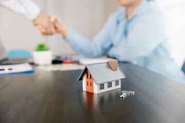 Real estate brokers or real estate agent with client or architect team Discussions about contracts , Saving money to invest in house or property in the future. Business property Concept.