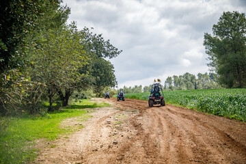 riding an all-terrain vehicle on a rural road