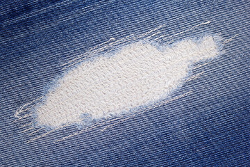 Blue jeans denim background texture. Torn jeans fabric material surface - 514660640
