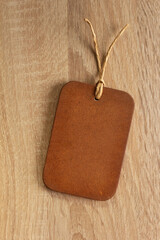 Wooden tag price on wood background. Front view of label