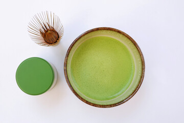 Japanese organic matcha latte green tea ceremony with bamboo whisk (chasen) and hooked bamboo scoop (chashaku) top view