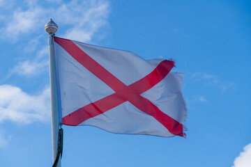 England St George Red Cross on White Background Flag flying in breeze showing fibres and movement