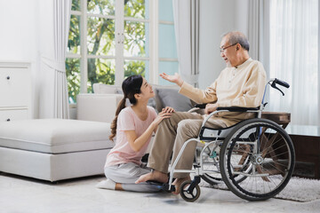 senior with beautiful daughter, old man sitting on wheelchair in house, take care elderly patient and be friends at home