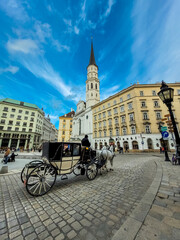 Naklejka premium Traditional Carriage with horses in the historic center of Vienna, Austria