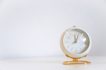 rose gold clock on white table and white background for design