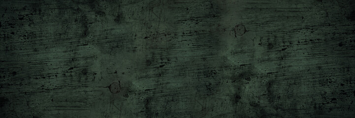 Black green wood texture. Old dirty painted wooden board surface. Close-up. Rustic vintage background with space for design. Web banner. Wide. Panoramic. Distressed, grungy, creepy.