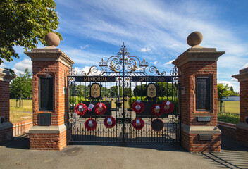 The War Memorial Gates at the entrance to the Recreation Ground in Stowmarket, Suffolk, UK