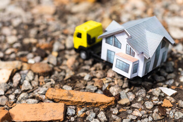 toy trucks with a house on a natural background