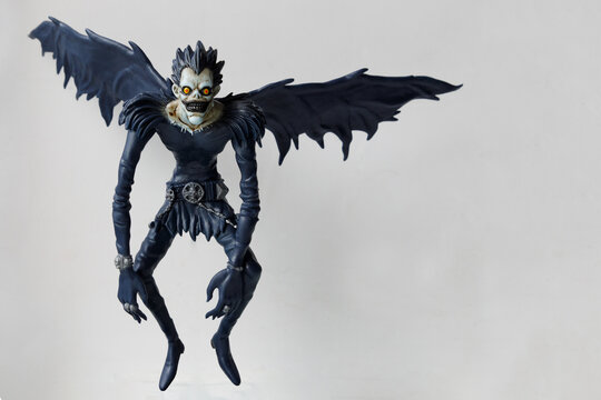 Russia Saint Petersburg 02.07.2022 Figurine of the god of death Ryuk on a gray background. Character anime DEATH NOTE