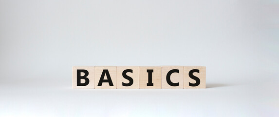 Basics symbol. Concept word Basics on wooden cubes. Beautiful white background. Business and Basics concept. Copy space.