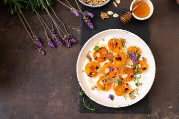 Grilled apricots with Greek yogurt, granola and honey. Summer breakfast
