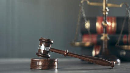 Gavel of justice on books background