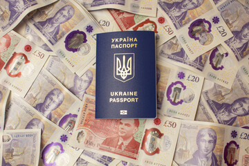 passport of ukraine on the background of english pounds, war in ukraine migration to england.