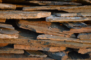 Rough texture of fine natural stone, photographed during golden hour, selective focus