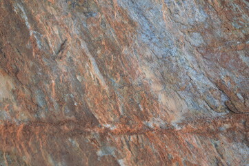 Rough texture of fine natural stone, photographed during golden hour, selective focus