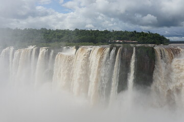 The photo shows a stunning view from the top of the Iguazu Falls — a complex of 275 waterfalls on the Iguazu River, located on the border of Brazil and Argentina