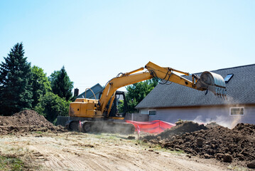 Construction Backhoe Digging House Foundation