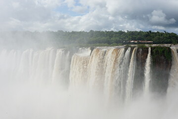 The photo shows a stunning view from the top of the Iguazu Falls — a complex of 275 waterfalls on...
