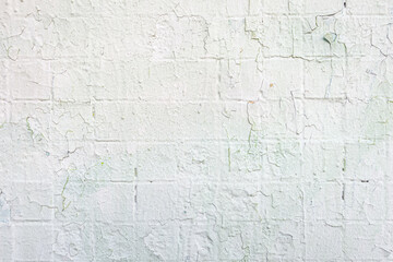 Obraz premium abstract background of an old shabby painted white tiled concrete wall close up