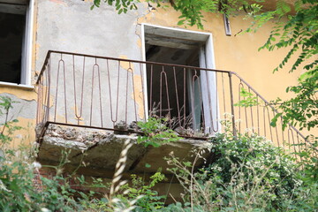 Empty broken balcony in Conza della Campania. Damaged house after 1980 Irpinia earthquake. 