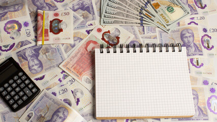 british money and calculator, notepad