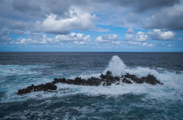Porto Moniz - Rocks and waves at vulcanic coast - beautiful landscape scenery of Madeira Island, Portugal. October 2021