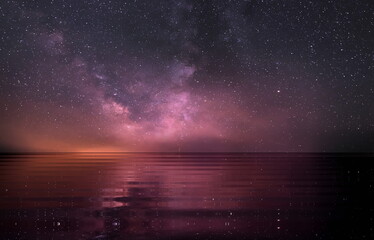 Naklejka na ściany i meble lilac blue starry night at sea water wave reflection nebula milky way space 