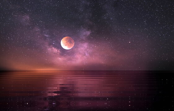  moon on  lilac blue starry night at sea water wave reflection milky way 