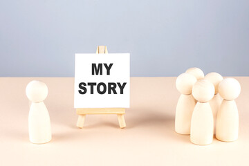 MY STORY text on easel with wooden figure, meeting concept