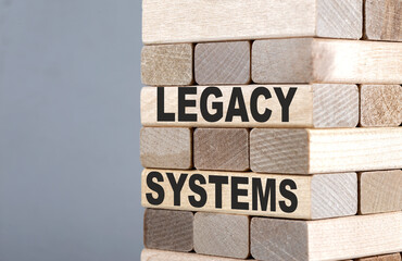 The text on the wooden blocks LEGACY SYSTEMS