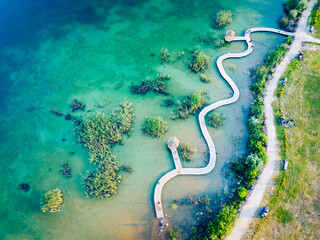 Turquiose Water and Wooden Bridge. Aerial Landscape. Park Grodek in Jaworzno, Poland. Polish Maldives.