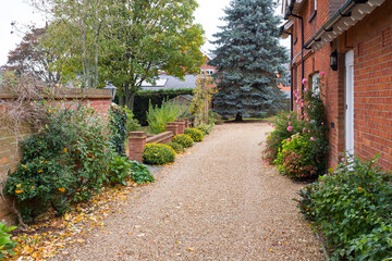 House, garden and driveway in autumn, UK
