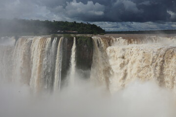 The photo shows a stunning view from the top of the Iguazu Falls — a complex of 275 waterfalls on the Iguazu River, located on the border of Brazil and Argentina