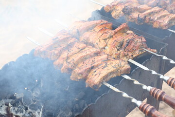 A photo of barbecue on the grill is being prepared