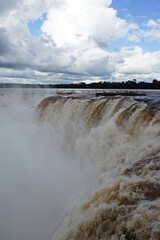 The photo shows a stunning view from the top of the Iguazu Falls — a complex of 275 waterfalls on the Iguazu River, located on the border of Brazil and Argentina