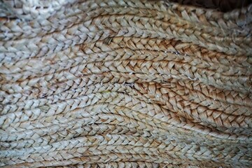 Beige Flechtwerkfläche mit Muster 