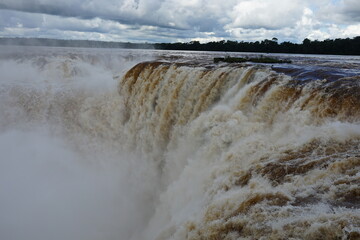 The photo shows a stunning view from the top of the Iguazu Falls — a complex of 275 waterfalls on the Iguazu River, located on the border of Brazil and Argentina