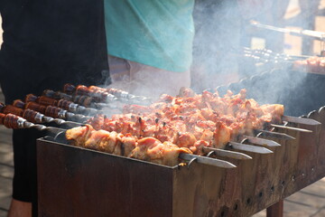 A photo of barbecue on the grill is being prepared