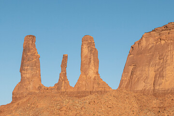 three sisters butte and blue sky in sunset mood